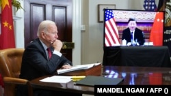 US President Joe Biden meets with China's President Xi Jinping over video conferencing from the Roosevelt Room of the White House in Washington, DC, November 15, 2021. (Photo by MANDEL NGAN / AFP)