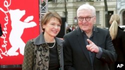 FILE - German President Frank-Walter Steinmeier (R) is seen with his wife, Elke Buedenbender in Berlin, Germany, Feb. 9, 2019. 