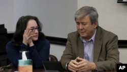 FILE - Rose Marie Kosmetatos, left, and her husband, Antonios Pagourtzis, parents of accused Santa Fe High School shooter Dimitrios Pagourtzis, talk before the start of the civil trial against them Aug. 16, 2024, 