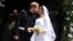 Prince Harry and Meghan, the Duchess of Sussex, kiss as they leave St George's Chapel at Windsor Castle after their wedding, May 19, 2018.
