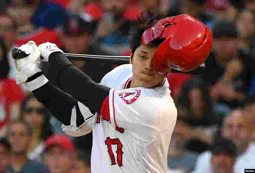 Los Angeles Angels designated hitter Shohei Ohtani (17) loses his batting helmet while knocking a ball foul against the Houston Astros in the first inning at Angel Stadium of Anaheim, California, July 15, 2019. (Credit: Jayne Kamin-Oncea-USA TODAY Sports)