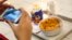 A woman takes a picture of her breakfast at Kellogg's Cafe NYC in New York, Dec. 14, 2017. 