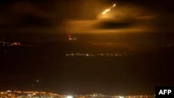 Israeli army flares light up the sky along the border with Lebanon late on Sept. 15, 2024 amid escalations in the ongoing cross-border tensions as fighting continues between Israel and Hamas militants in the Gaza Strip.