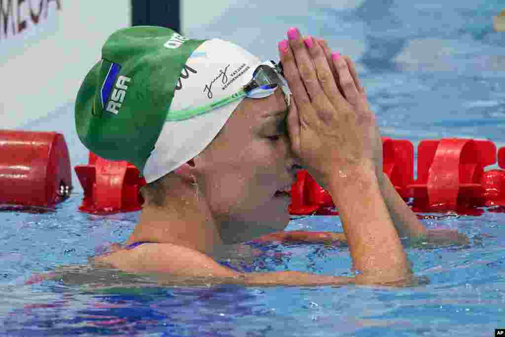 Tatjana Schoenmaker, of South Africa, reacts after a heat during the women&#39;s 100-meter breaststroke at the 2020 Summer Olympics, Sunday, July 25, 2021, in Tokyo, Japan. (AP Photo/Charlie Riedel)