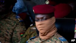 FILE - Burkina Faso coup leader Capt. Ibrahim Traore participates in a ceremony in Ouagadougou, Oct. 15, 2022. 