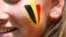 FILE - A Belgium fan waits for the group G match between Belgium and Tunisia at the 2018 soccer World Cup in the Spartak Stadium in Moscow, Russia, June 23, 2018.