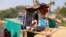 FILE PHOTO: Amir Ali, 75, plays a violin in front of his house in Kutuapalong Rohigya refugee camp in Cox's Bazar, Bangladesh, Feb. 8, 2019.