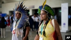 Members of Brazil's Indigenous delegation arrive to the opening ceremony of COP16, a United Nations' biodiversity conference, in Cali, Colombia, Oct. 20, 2024.