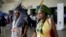 Members of Brazil's Indigenous delegation arrive to the opening ceremony of COP16, a United Nations' biodiversity conference, in Cali, Colombia, Oct. 20, 2024.