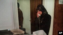 Zhila Bani-Yaghoub speaks on the telephone in her office in Tehran in this file photo. 