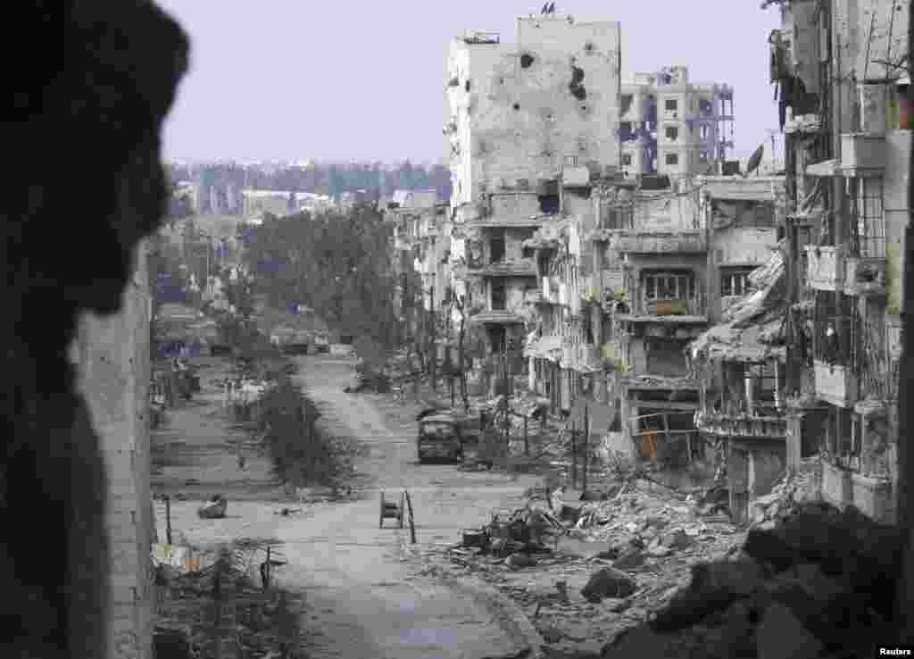 Damaged buildings line a deserted street in the besieged area of Homs, Jan. 9, 2014.&nbsp;