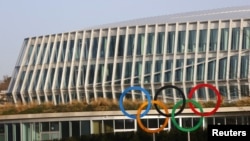 The Olympic rings are seen in front of the International Olympic Committee (IOC) headquarters, in Lausanne, Switzerland, Feb. 24, 2021.