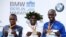 Athletics - Berlin Marathon - Berlin, Germany - September 16, 2018 Kenya's Eliud Kipchoge (C) poses with the medal after winning the Berlin Marathon alongside second placed Amos Kipruto of Kenya (L) and third placed Wilson Kipsang of Kenya (R).