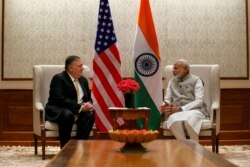 U.S. Secretary of State Mike Pompeo, left, talks with Indian Prime Minister Narendra Modi during their meeting at the Prime Minister's Residence, June 26, 2019, in New Delhi, India.