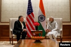 U.S. Secretary of State Mike Pompeo (L), talks with Indian Prime Minister Narendra Modi during their meeting at the Prime Minister's Residence, June 26, 2019, in New Delhi, India.