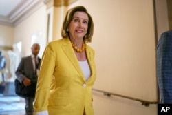 Speaker of the House Nancy Pelosi, D-Calif., walks to her office as the select committee on the Jan. 6 attack prepares to hold its first hearing Jan. 26, 2021.