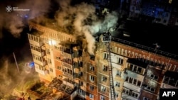 This handout photograph taken by the Ukrainian Emergency Service and released on December 2, 2024, shows a residential building on fire following a Russian air attack, in Ternopil, amid the Russian invasion of Ukraine.