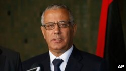 FILE - In this Oct. 8, 2013 file photo, Libyan's Prime Minister Ali Zidan speaks to the media during a press conference in Rabat, Morocco.