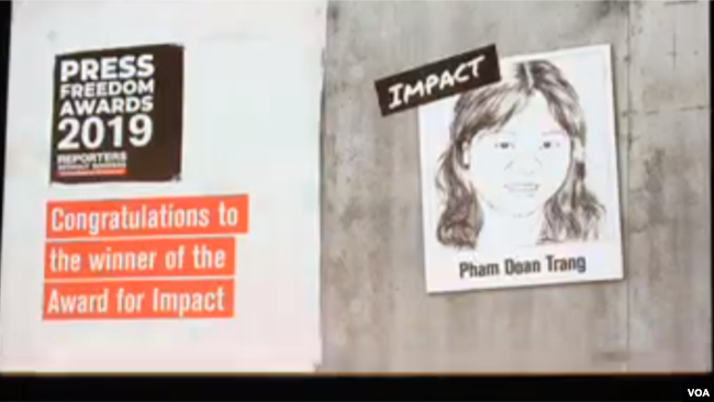 FILE - Reporters Without Borders (RSF) awarded Vietnamese journalist and blogger Pham Doan Trang a 2019 Press Freedom Prize for Impact, Sept. 12, 2019, in Berlin.