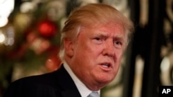 FILE - President-elect Donald Trump speaks to reporters at Mar-a-Lago, Dec. 28, 2016, in Palm Beach, Florida. 