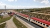 FILE - A general view shows a train on the Standard Gauge Railway line constructed by the China Road and Bridge Corporation and financed by Chinese government in Kenya, Oct. 16, 2019. 