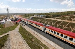 FILE - A general view shows a train on the Standard Gauge Railway line constructed by the China Road and Bridge Corporation and financed by Chinese government in Kenya, Oct. 16, 2019.