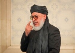 FILE - Taliban negotiator Sher Muhammad Abbas Stanekzai attends a conference arranged by the Afghan diaspora, in Moscow, Feb. 5, 2019.