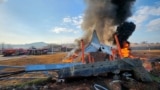 Firefighters douse flames from a plane that went off the runway at Muan International Airport in Muan, South Jeolla Province, South Korea, Dec. 29, 2024. 