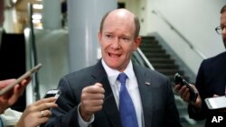 Sen. Chris Coons, D-Del., speaks to reporters after a briefing of the Senate by Deputy Attorney General Rod Rosenstein, amid controversy over President Donald Trump's firing of FBI Director James Comey, at the Capitol in Washington, May 18, 2017. When asked whether Comey would appear before Congress, Coons said it remained to be seen "how ongoing congressional investigations will be coordinated with the special counsel."