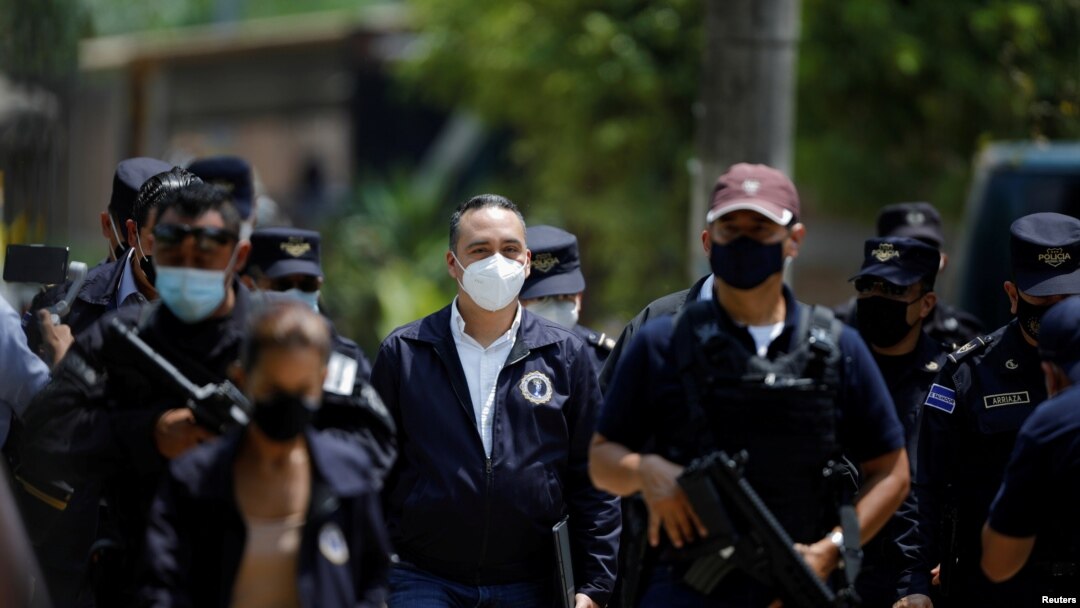 FILE PHOTO: Attorney General Rodolfo Delgado arrives at a news conference at the site where authorities are excavating a clandestine cemetery discovered at the house of a former police officer in Chalchuapa, El Salvador, May 21, 2021.