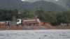 A truck is pouring sand into the sea in Kep province, Cambodia, Dec. 27, 2021. (Sun Narin/VOA Khmer) 