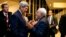 FILE - U.S. Secretary of State John Kerry talks with Iranian Foreign Minister Mohammad Javad Zarif in Vienna, after the International Atomic Energy Agency verified that Iran has met all conditions under the nuclear deal, Jan. 16, 2016.