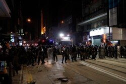 Police arrive to chase away protestors in Hong Kong, Jan. 1, 2020.