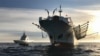 FILE - A handout picture released by Argentina's Navy press office shows the ARA “Bouchard” Ocean Patrol escorting a Chinese flag fishing ship after it was caught illegally operating in Argentina's Exclusive Economic Zone, May 4, 2020.