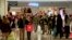 FILE - Shoppers walk inside the Glendale Galleria in Glendale, California.
