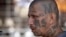 En esta fotografía, un miembro de la pandilla MS-13 asiste a misa en una prisión en Ciudad Barrios, El Salvador. Los fiscales federales creen que la MS-13, o Mara Salvatrucha, tiene miles de miembros en todo Estados Unidos, principalmente inmigrantes de Centroamérica.