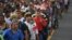 Honduran migrants take part in a caravan heading to the US on the road linking Ciudad Hidalgo and Tapachula, Chiapas state, Mexico, Oct. 21, 2018.