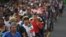 Honduran migrants take part in a caravan heading to the US on the road linking Ciudad Hidalgo and Tapachula, Chiapas state, Mexico, Oct. 21, 2018.