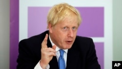  Britain's Prime Minister Boris Johnson speaks during the first meeting of the National Policing Board at the Home Office in London, July 31, 2019.