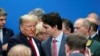 U.S. President Donald Trump talks with Canada's Prime Minister Justin Trudeau during a North Atlantic Treaty Organization Plenary Session at the NATO summit in Watford, near London, Britain, Dec. 4, 2019.