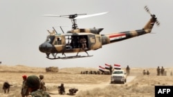 Thousands of Iraqi soldiers take part in a training exercise led by the Spanish Army and under the guidance of the U.S. military in the Basmaya camp in the Iraqi capital Baghdad.