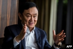 This picture taken on March 25, 2019, shows exiled former Thai prime minister Thaksin Shinawatra being interviewed by Agence France-presse in Hong Kong.