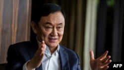 This picture taken on March 25, 2019, shows exiled former Thai prime minister Thaksin Shinawatra being interviewed by Agence France-presse in Hong Kong.