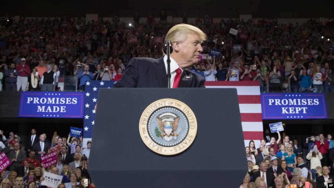 President Donald Trump pauses while speaking at a rally at the Kentucky Exposition Center in Louisville, Ky., March 20, 2017.