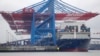 FILE - In this July 1, 2017 file photo containers are stacked on 'Zheng He' of China at the container terminal of the harbor of Hamburg, Germany. 