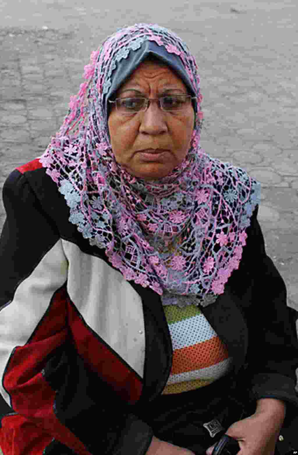 Rida Eid Mohamed, 60, is a retired nurse says, "The Military Council has never been against the people - never. And I don't just mean this time. The Egyptian  military has protected the people since the war in 1973. People are rioting and the army is only