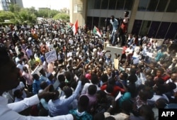 FILE - Protesters rally against police violence in Khartoum, Sudan, Sept. 23, 2019.
