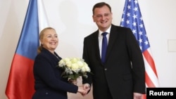 U.S. Secretary of State Hillary Clinton shakes hands with with Czech Prime Minister Petr Necas in Prague December 3, 2012. 