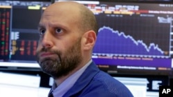 Specialist Meric Greenbaum works on the floor of the New York Stock Exchange, Feb. 2, 2018. 