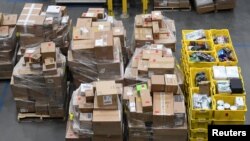 FILE - Products in the prep area are seen at the Amazon fulfilment center in Baltimore, Maryland, April 30, 2019. 